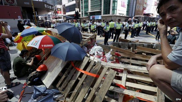 Pro-democracy protesters re-occupy Argyle street after police dismantled their barricades in Mong Kok District, Hong Kong, 18 October 2014