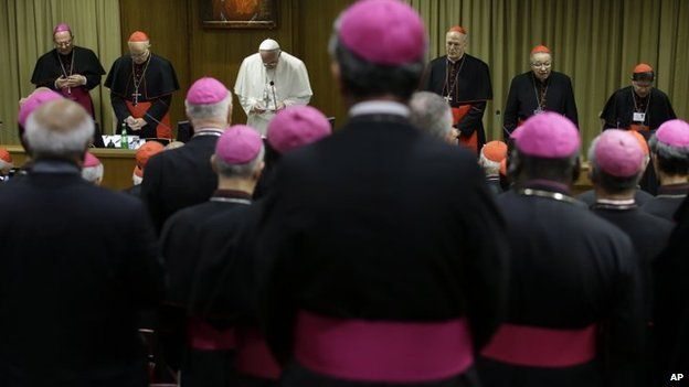 Pope Francis prays as he opens the morning session of a two-week synod on family issues at the Vatican, 18 October 2014
