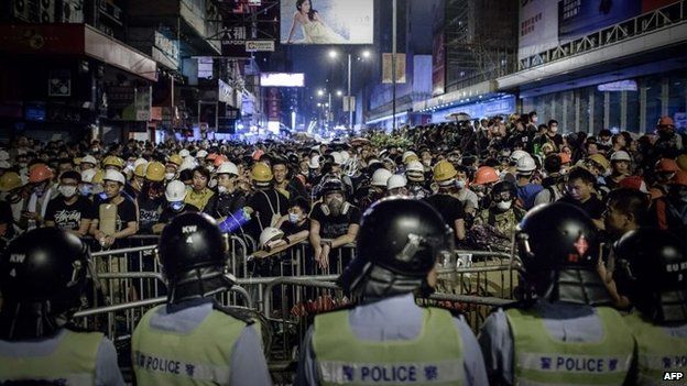 Pro-democracy protesters stand their ground in the Mong Kok district of Hong Kong, 19 October 2014