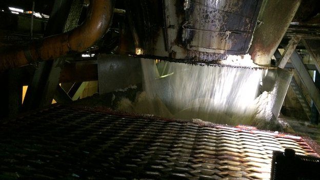 Inside a machine for processing sugar cane