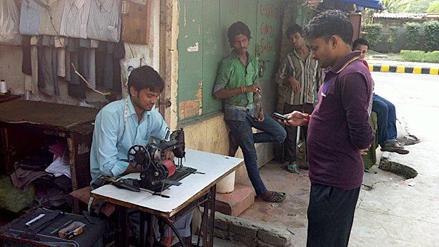 For people like this street tailor, getting online can be simply too expensive