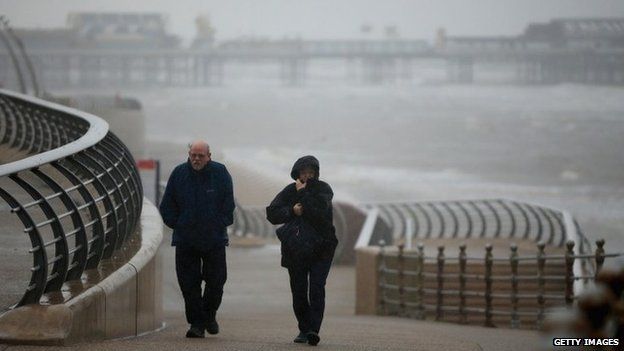 Visitors brave high winds and rain on Blackpool promenade