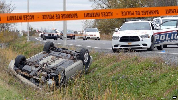 A car is overturned in the ditch in St-Jean-sur-Richelieu, Quebec, on 20 October 2014