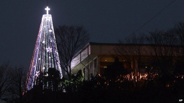 This Tuesday, 21 Dec 2010 photo shows a giant steel Christmas tree lit up at the western mountain peak known as Aegibong in Gimpo, South Korea