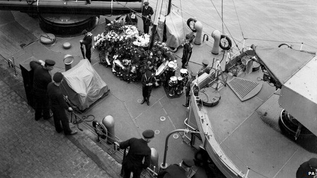 Royal Navy Bluejackets guard the coffin of the unknown warrior aboard HMS Verdun before it was taken to Westminster Abbey for burial.