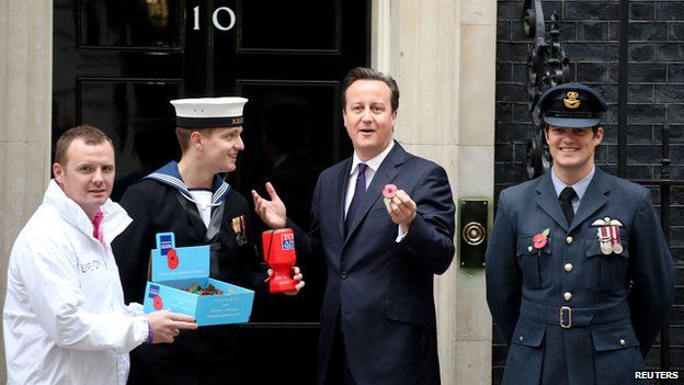 David Cameron buys a poppy