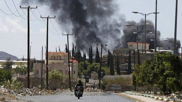 Smoke rises from an area where Shia Houthi rebels are fighting against government forces in Sanaa - 21 September 2014