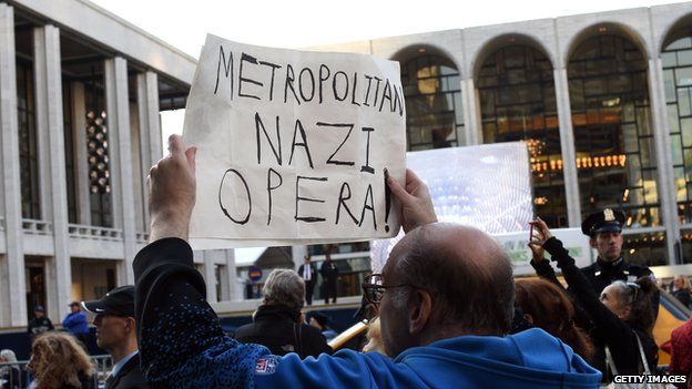 A protestor holds up a sign during demonstrations at the Lincoln Center before the premier of the Death of Klinghoffer.