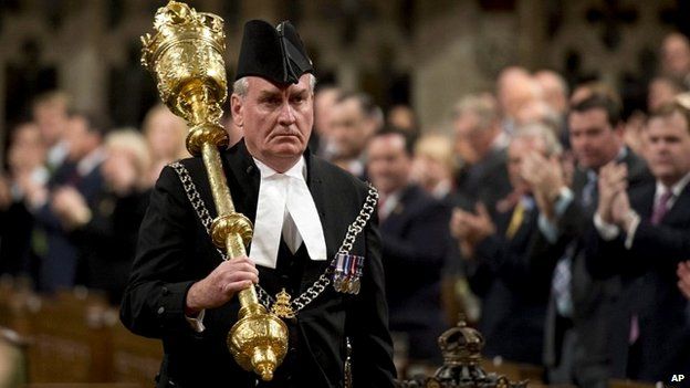 The Sergeant-at-Arms Kevin Vickers receives a standing ovation as he enters the House of Commons in Ottawa - 22 October 2014