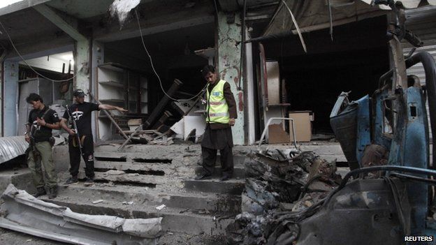 Security officials inspect the site of a suicide attack in Quetta