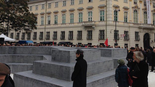 Onlookers walk around Austria's memorial to WW2 deserters