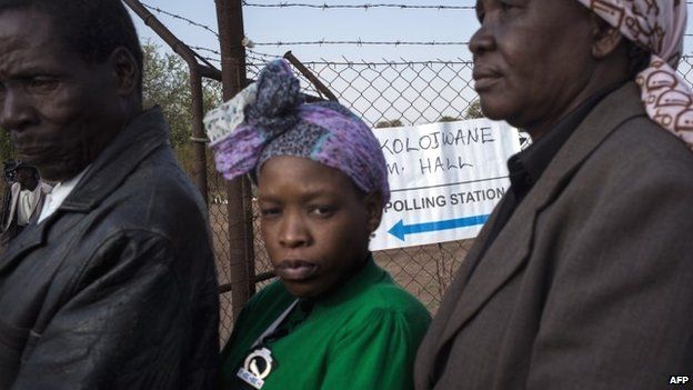 Residents queue to cast their ballots at a polling station in Serewe on 24 October 2014 for Botswana's general elections