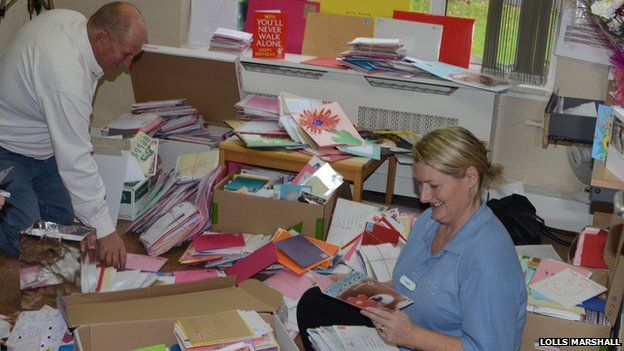 Staff opening Betty Musker's cards