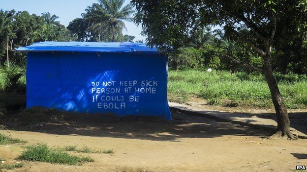 An Ebola information sign painted on a hut in Port Loko district one of the hardest hit areas due to the Ebola virus Sierra Leone 25 October 2014.