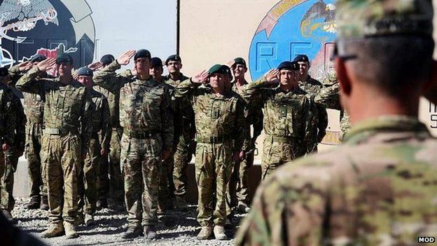 Afghan soldiers saluting