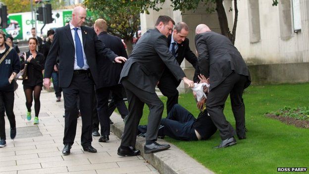 Man surrounded by police offers after running into David Cameron