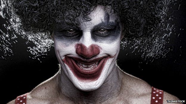 Evil clown smiling