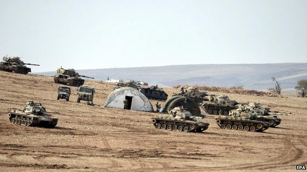 Turkish soldiers and tanks near the Turkish-Syrian border on 27 October 2014