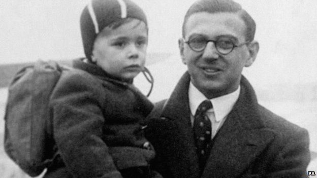 Undated family handout picture of Nicholas Winton with one of the children he rescued