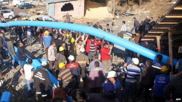 Rescuers in Turkey use pipes to pump out water