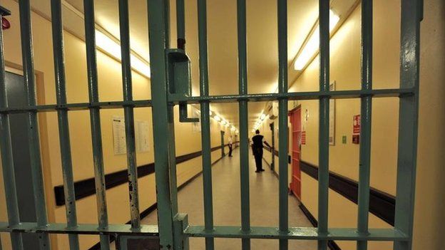 A barred door in Wormwood Scrubs, a Category B prison in London