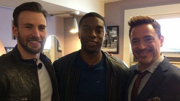 Robert Downey Jr (right) appeared with Captain America co-stars Chris Evans (left)and Chadwick Boseman