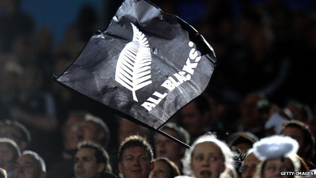 New Zealand All Black flag flown during 2011 Rugby World Cup semi-final match at Eden Park Stadium in Auckland. 16 October 2011