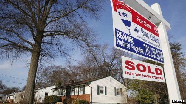 Sold sign hangs in front of a house in Vienna, Virginia