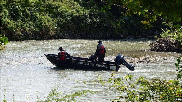 Federal Police conduct a search search in the Cocula River near the Cocula Community, Guerrero State, Mexico on October 29, 2014.