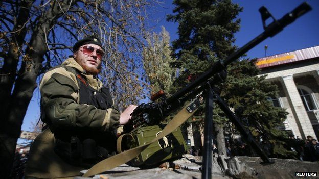 Pro-Russian separatist guards his position near the Kholodnaya Balka mine in Makiyivka, outside Donetsk, eastern Ukraine