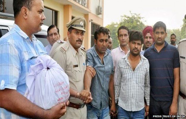 Haryana Police present the Gohana bank heist accused to the media in Sonepat on Thursday.