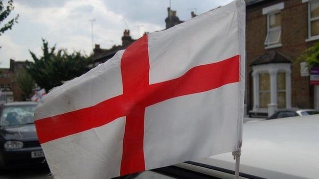 England flag flying from a car