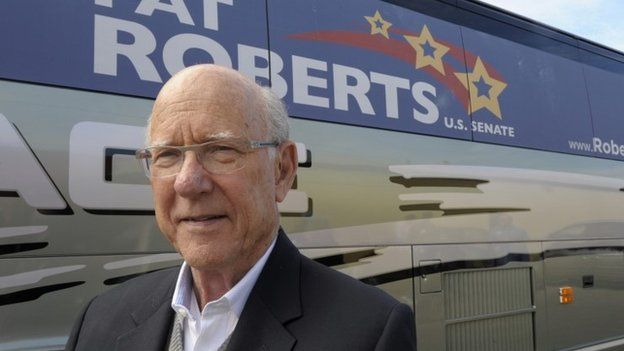 Republican US Senator Pat Roberts stands outside his campaign bus after a rally in Paola, Kansas 11 October 2014