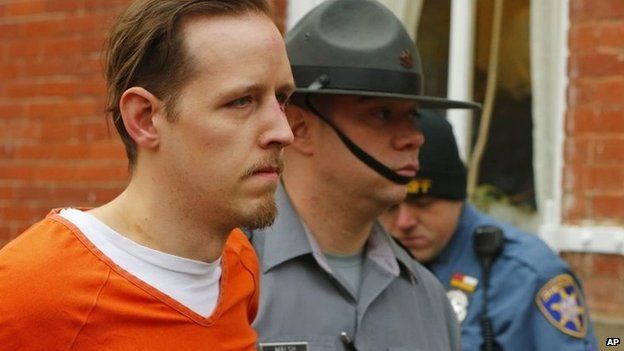 Eric Frein is escorted by police out the Pike County Courthouse after his arraignment in Milford, Pennsylvania 31 October 2014