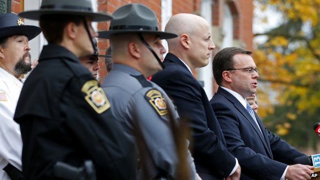 Pike County District Attorney Ray Tonkin, right, holds a news conference to talk about the arraignment of Eric Frein at the Pike County Courthouse in Milford, Pennsylvania 31 October 2014