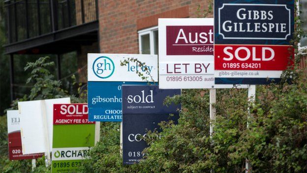 A row of estate agent boards