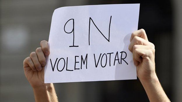 A Student holds a sign saying, 'November 9, we want to vote' during a protest in October, 2014