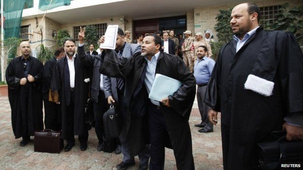 Libyan lawyers celebrate after the court invalidated the country's parliament, outside the Supreme Court in Tripoli, November 6, 2014