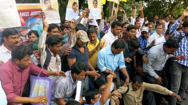 Protesters in Calcutta hold up the certificates issued by a number of bogus companies