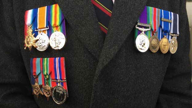 Graham Foord wearing his medals along with those of his father and grandfather