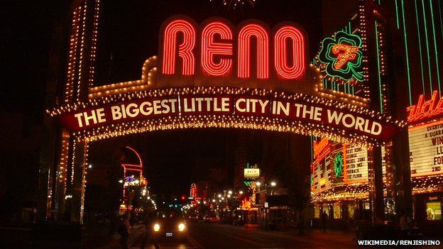 An illuminated sign reading "Reno: The biggest little city in the world"