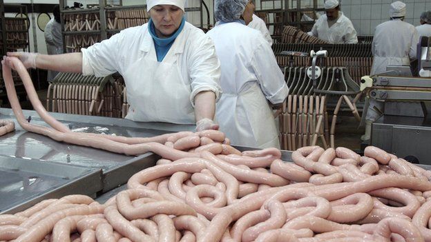 Raw sausages being made