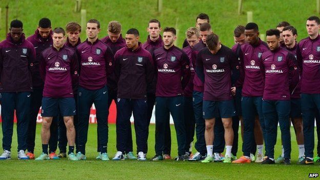 The England football squad observe a two-minute silence while training