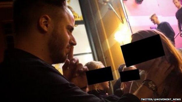 Picture of Julien Blanc seemingly choking a girl in the street as part of his "pick up" technique