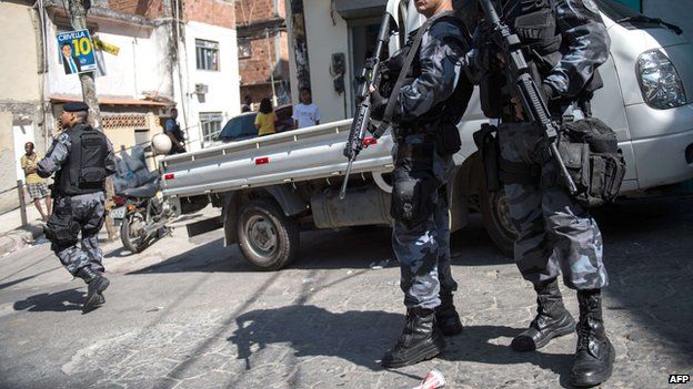 Police patrolling a Rio de Janeiro slum