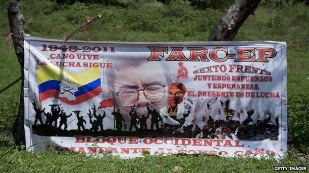 A billboards praising the late Farc leader Alfonso Cano is seen in the road between Caloto and Toribio on 7 November, 2014