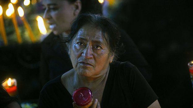A woman prays at a temple outside Guatemala City