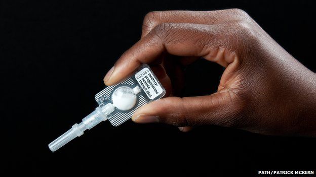 Close up of hand holding the Sayana Press contraceptive device