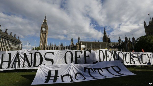 A banner outside Parliament saying: "Hands off democracy #noTTIP"