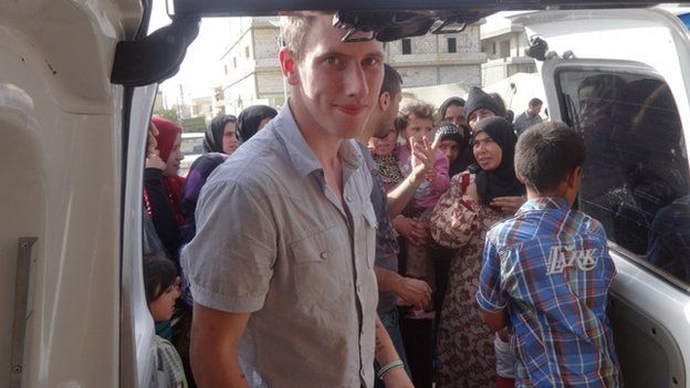 Undated photo provided by Kassig family showing Peter Kassig delivering supplies for Syrian refugees.